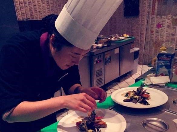 Chef arranging food on plates