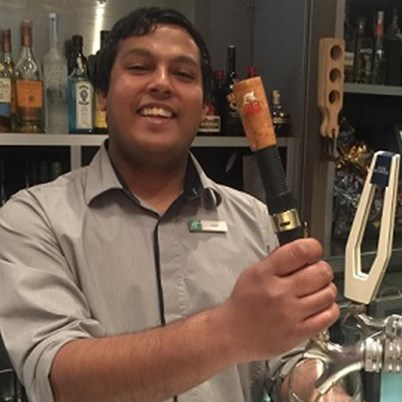 Image of cheery barman